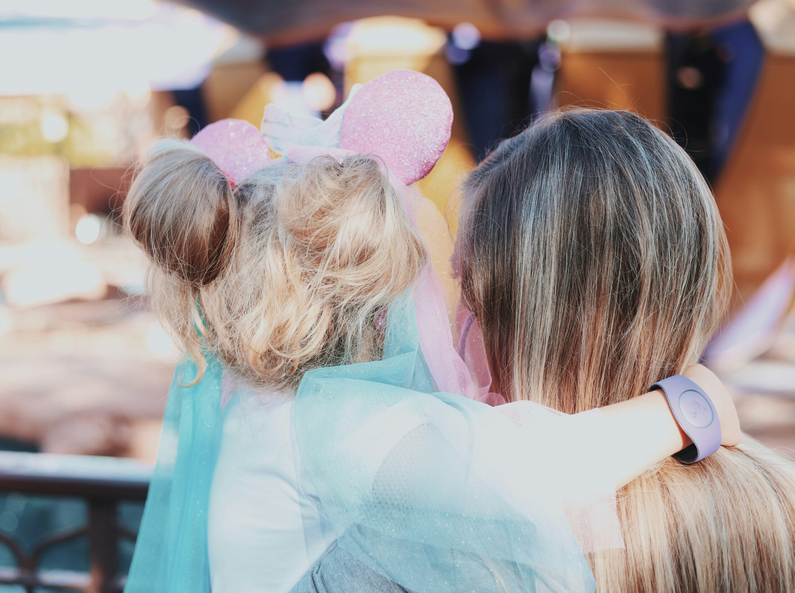 people hugging in disney world 