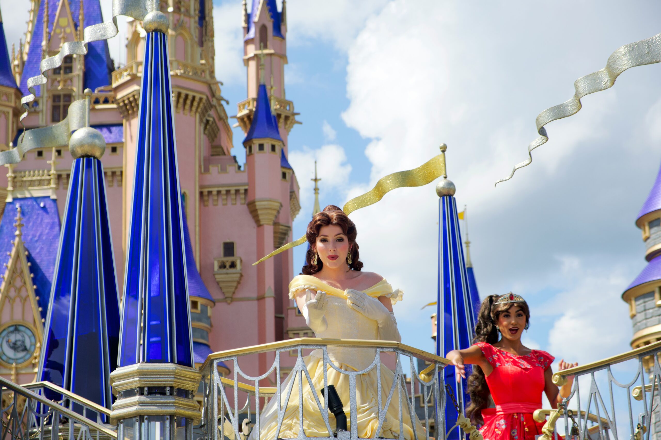 Belle character waving Cinderella Castle 