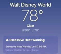 Phone screen showing temperature and excessive heat warning