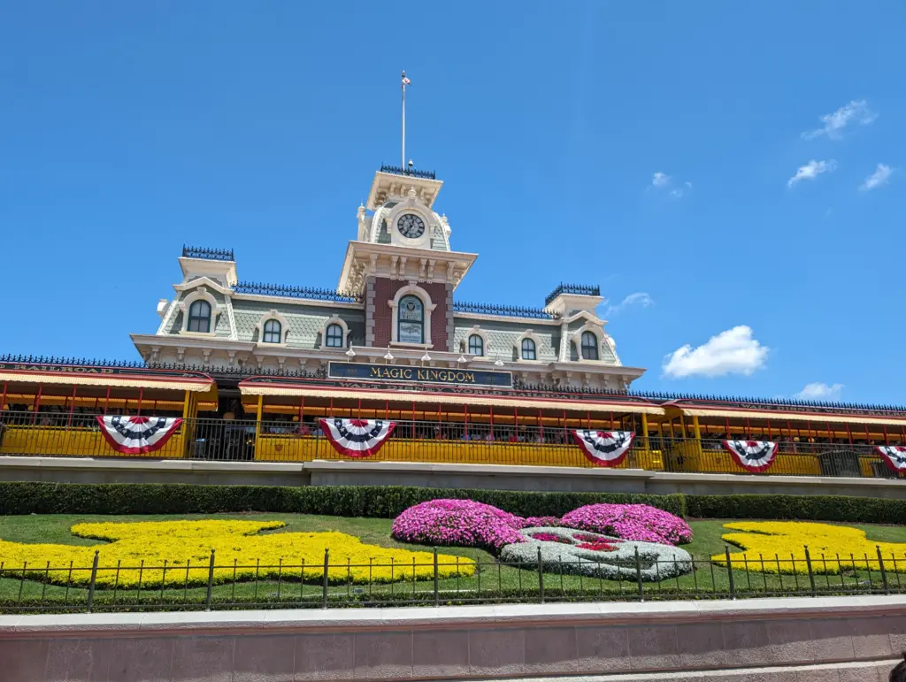 Spring day weather Magic Kingdom station train flowers