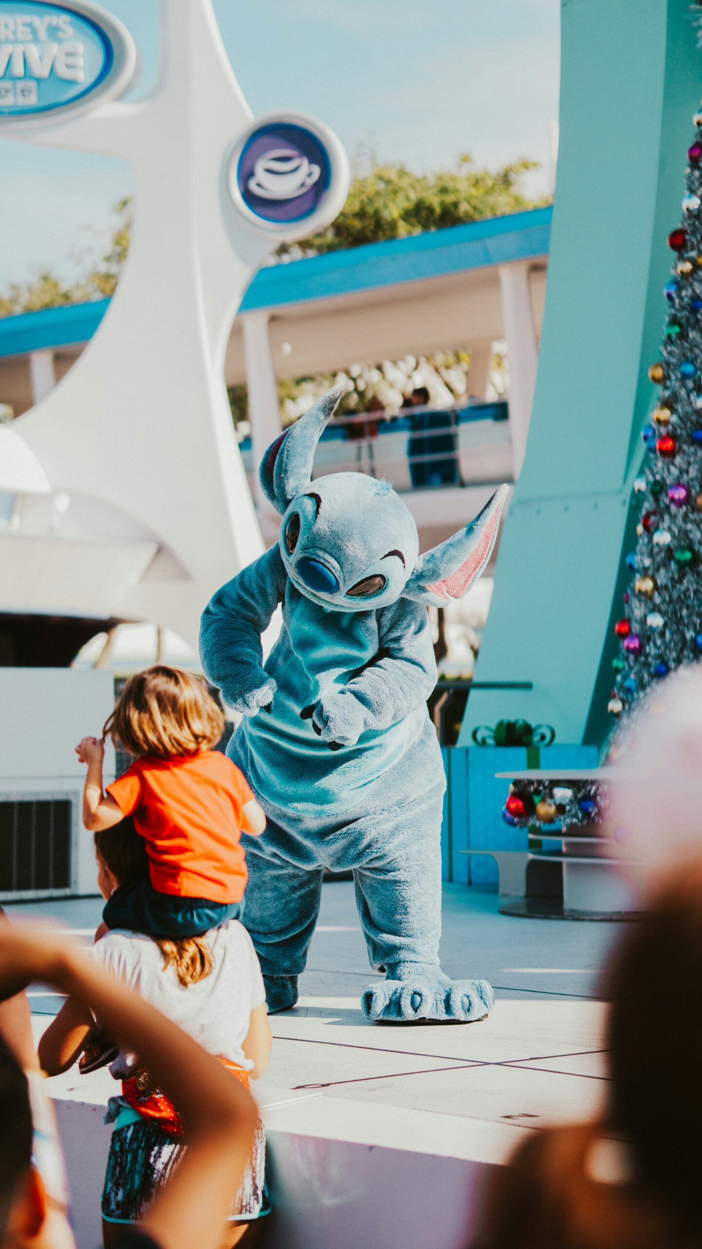 stitch character with child on person's shoulders